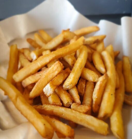 A close up of some french fries in a basket